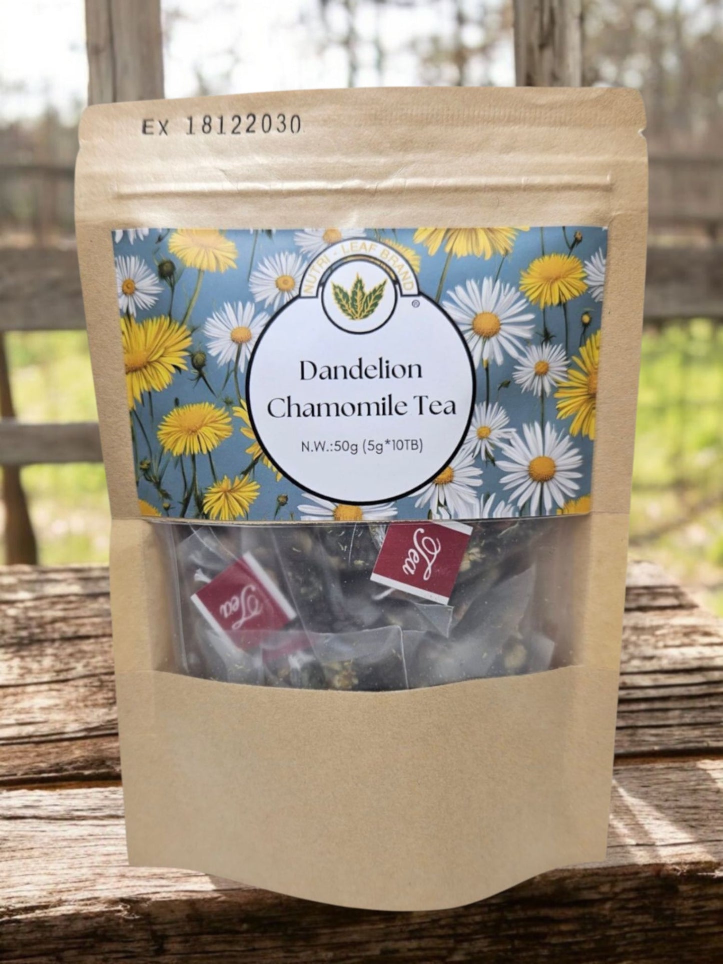Package of Dandelion Chamomile Tea with floral label on a wooden surface