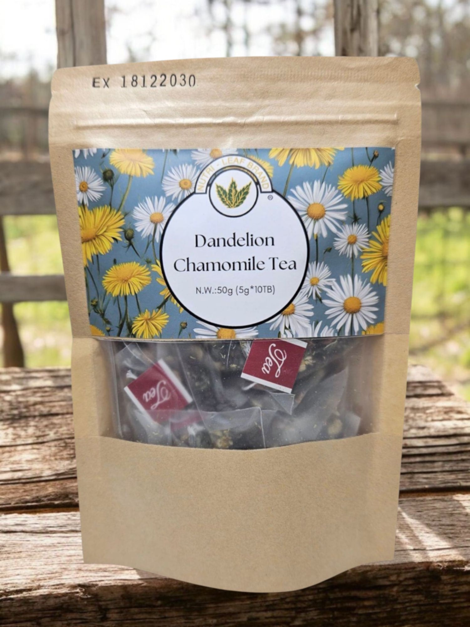 Package of Dandelion Chamomile Tea with floral label on a wooden surface
