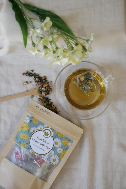 Tea bag, cup of tea with flowers, and a bouquet of white flowers on a light background