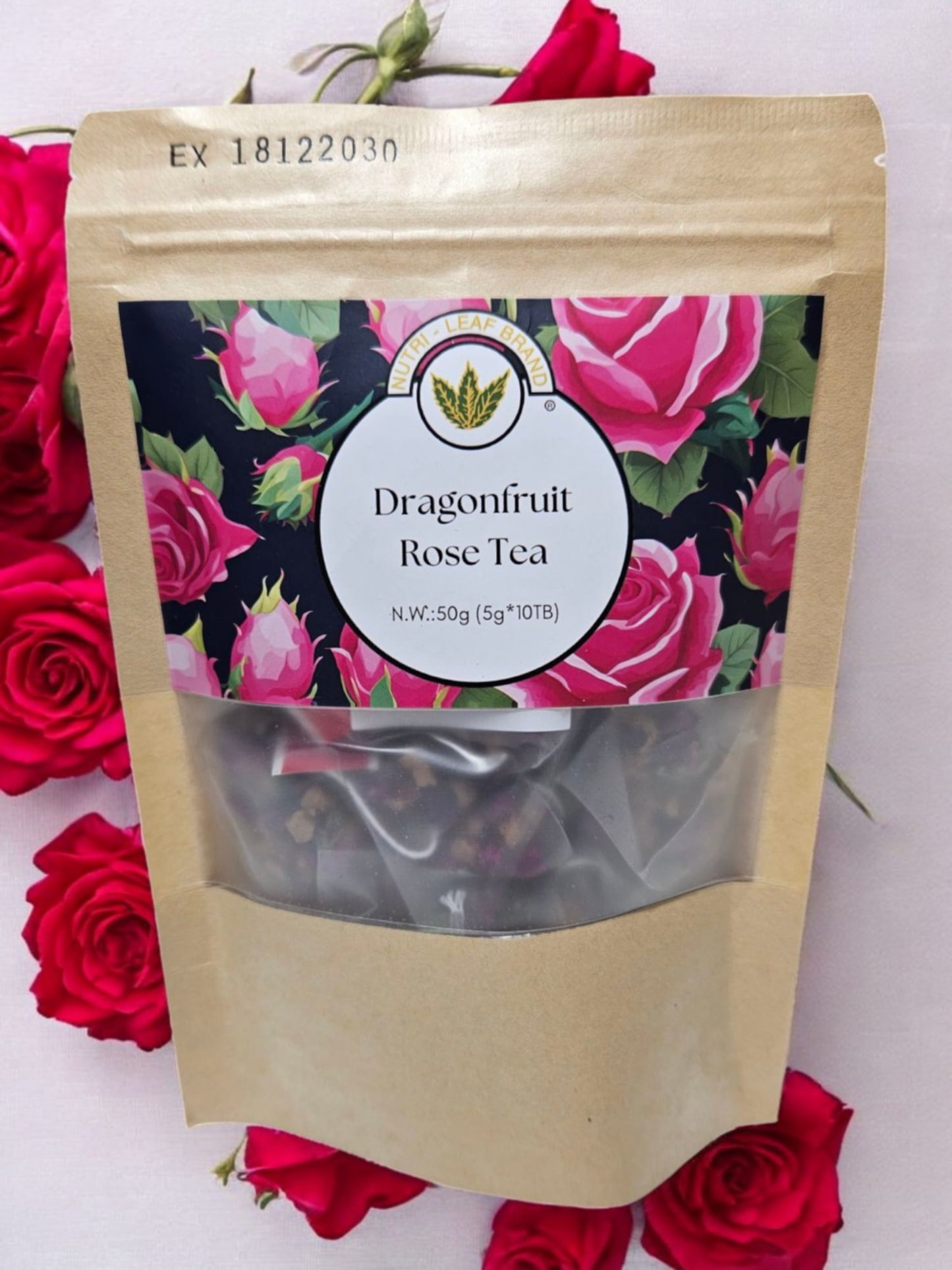Dragonfruit Rose Tea package with floral design on a white background