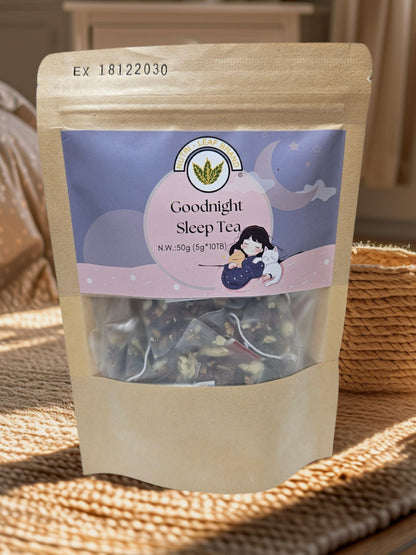 Packaging of 'Goodnight Sleep Tea' with a clear window showing the tea leaves inside. The label has a blue background with white and blue colors, and text including the product name and an illustration of a girl resting.